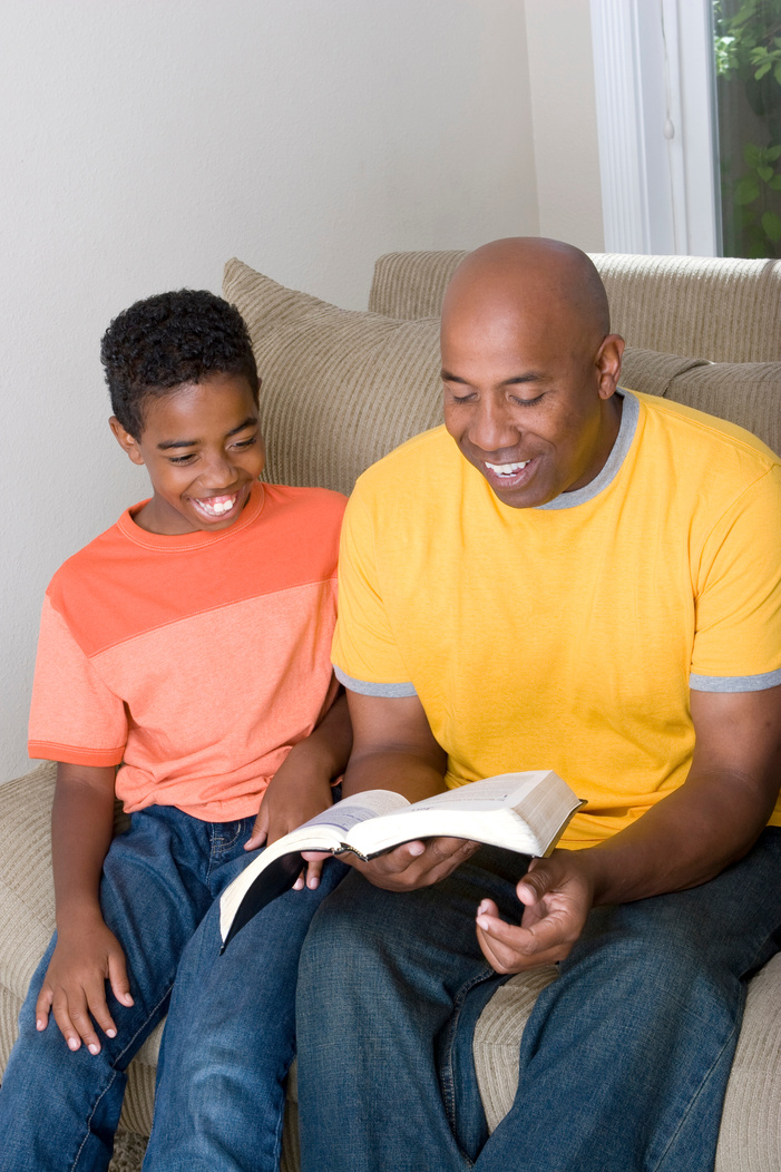 Father and son reading the bible